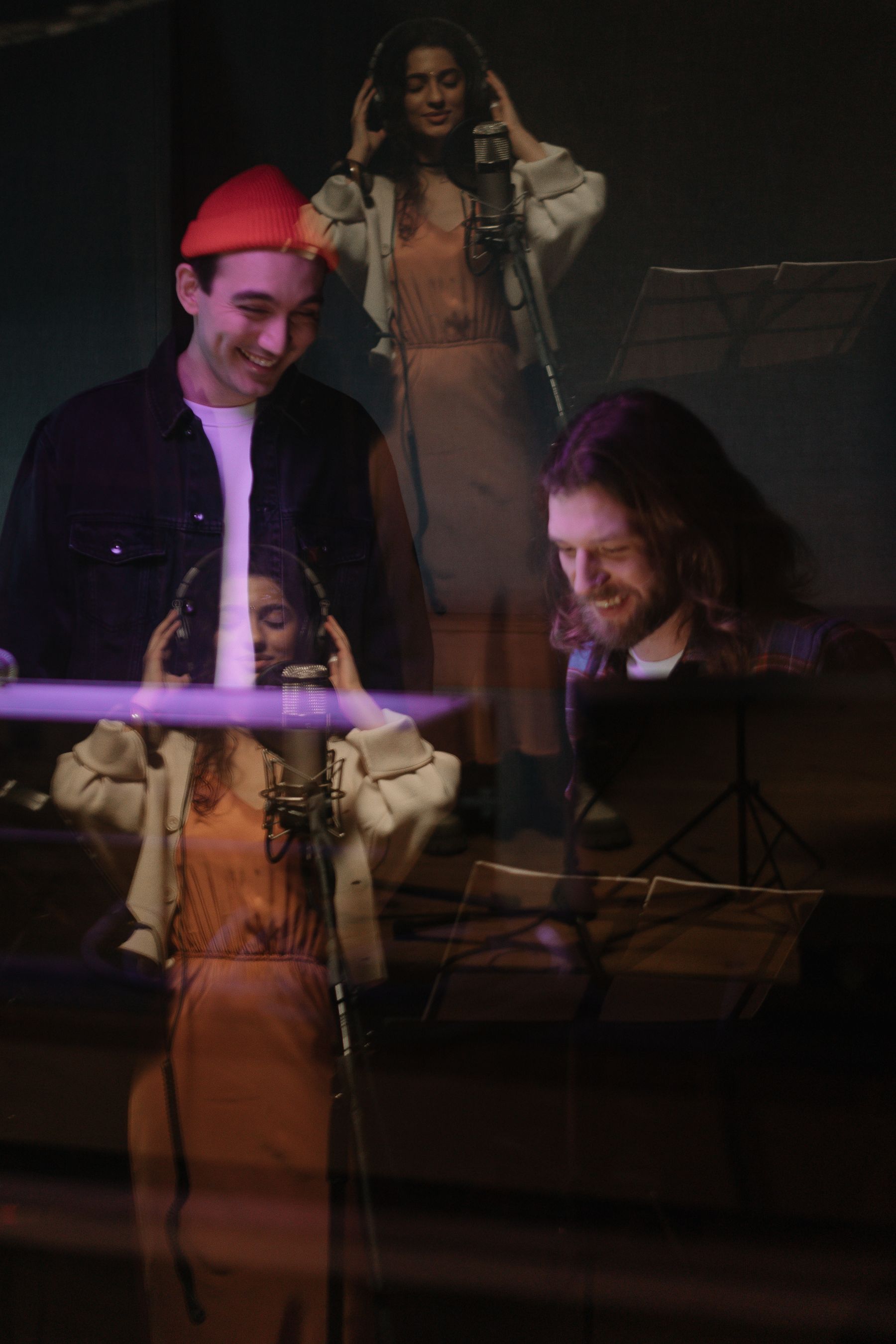 Musicians collaborating during a recording session in a studio