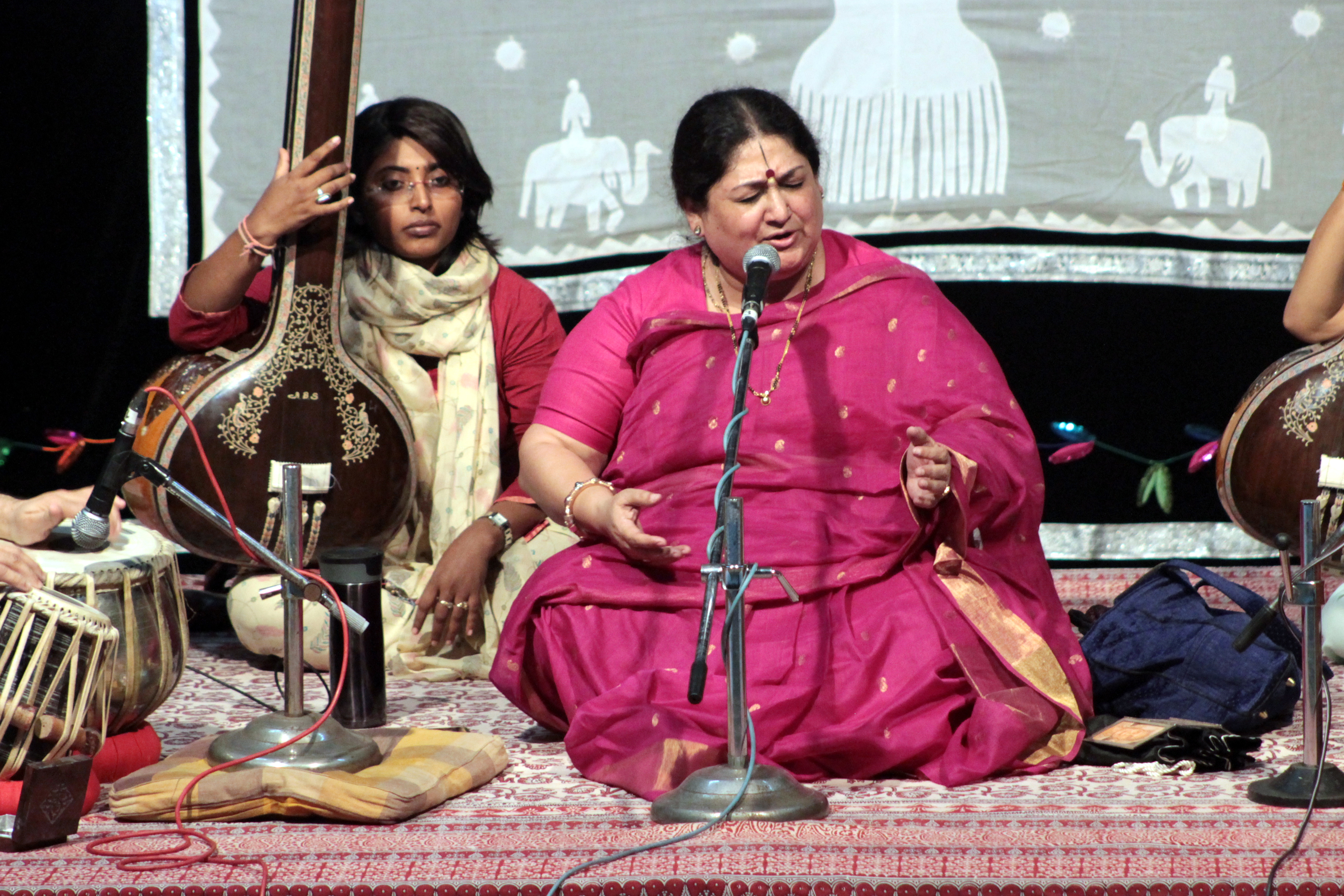 Shubha Mudgal performing Hindustani classical music on stage with accompanying musicians
