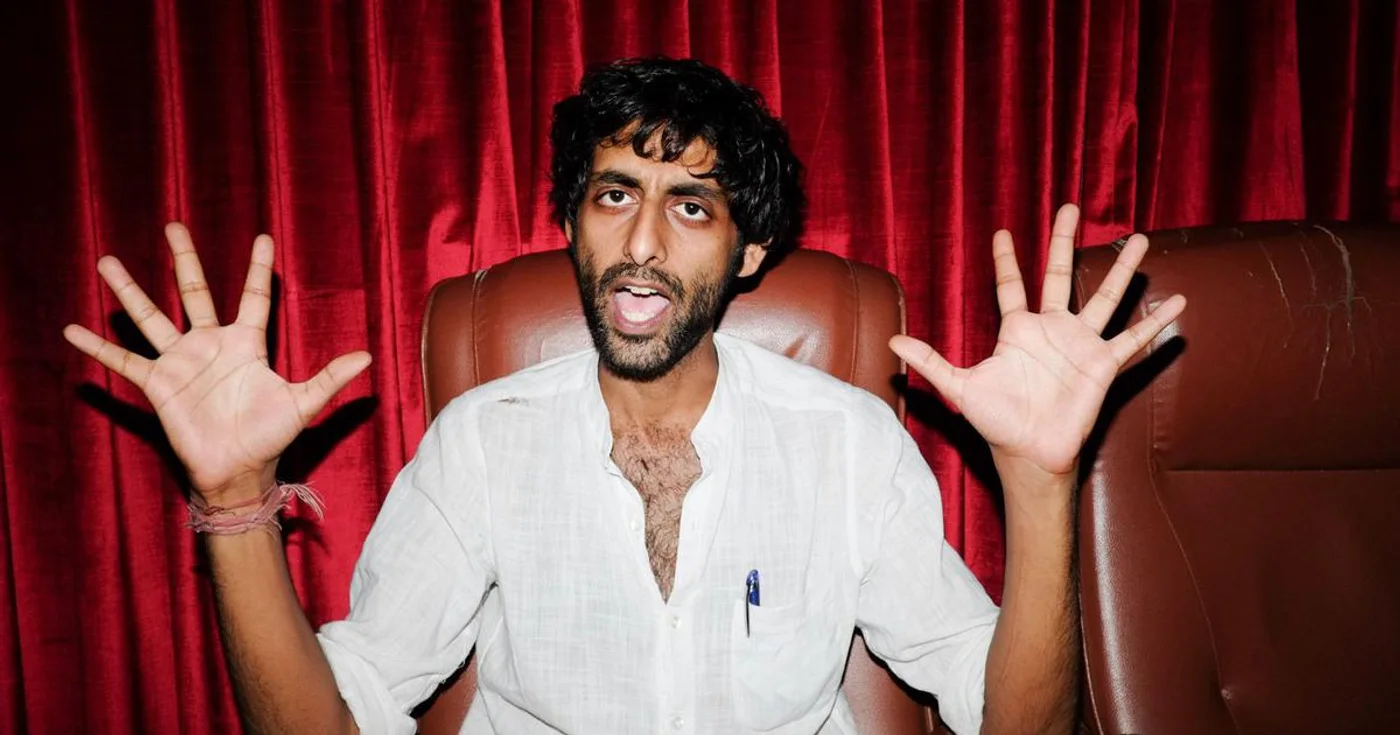 Lifafa during the Jaago era, seated against red theatre curtains