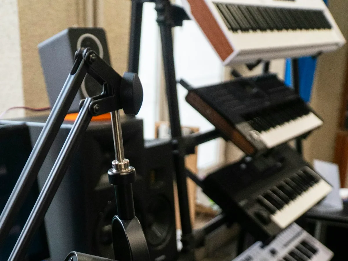 A recording studio with a microphone and keyboard, illustrating the metadata and documentation that should travel with a finished recording