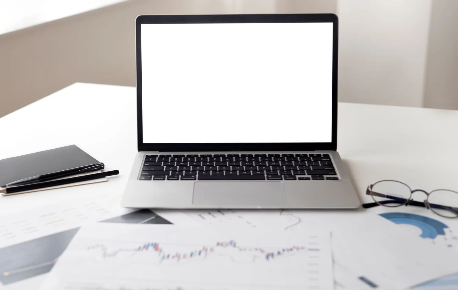 A laptop with financial documents, representing the invoice and payment records a freelancer should keep