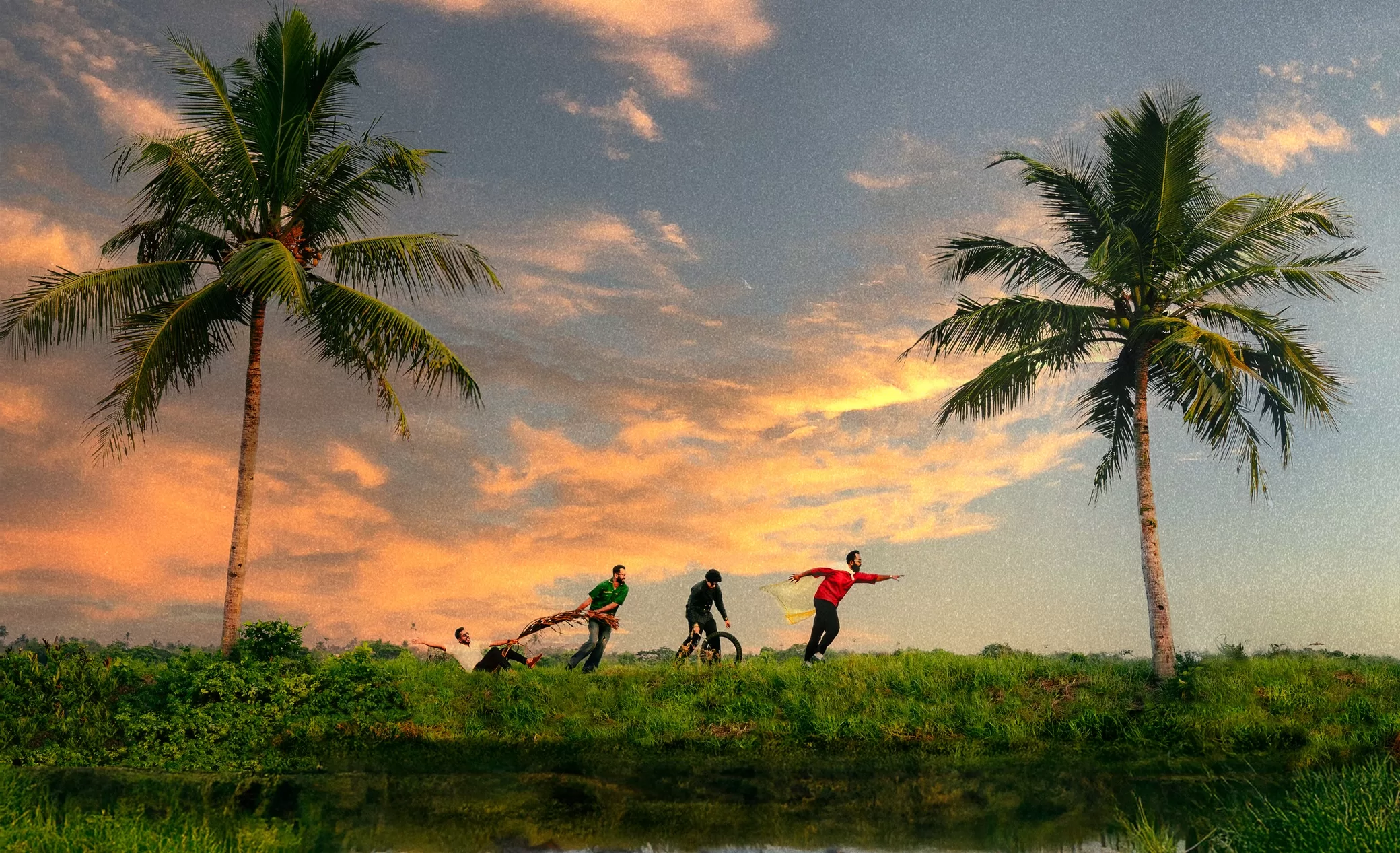 When Chai Met Toast's Dreamland artwork shows the four band members running beneath Kerala coconut palms at sunset