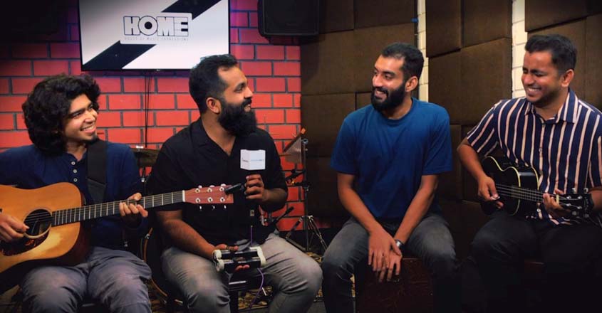 When Chai Met Toast sit together with guitars in a rehearsal room during the Nee Aara era